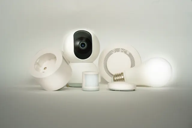 Home security camera beside wireless sensor devices