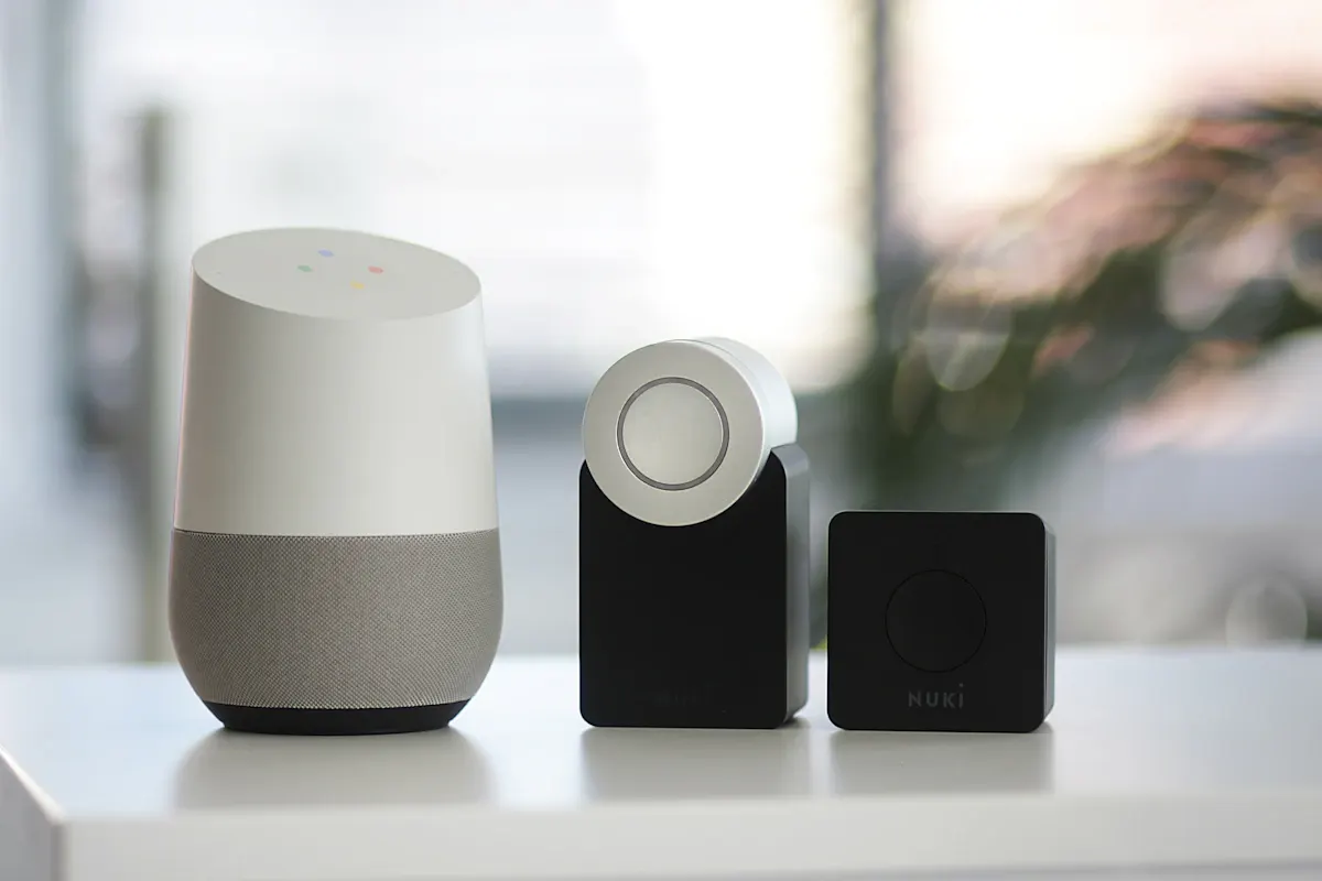 Smart speaker beside two home-control accessories
